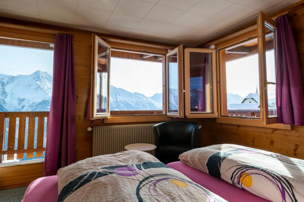 Postel nebo postele na pokoji v ubytování Chalet Weisshorn 2
