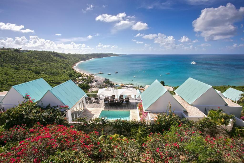 an aerial view of a resort with the ocean at CeBlue Villas in The Valley