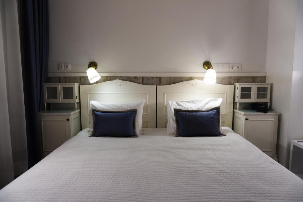 Postel nebo postele na pokoji v ubytování Hotel Divan