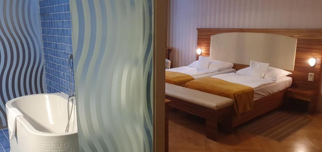 Postel nebo postele na pokoji v ubytování Hotel Okresní Dům