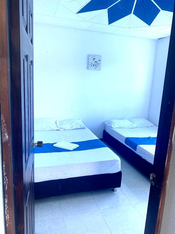 Postel nebo postele na pokoji v ubytování La Morena Hospedaje