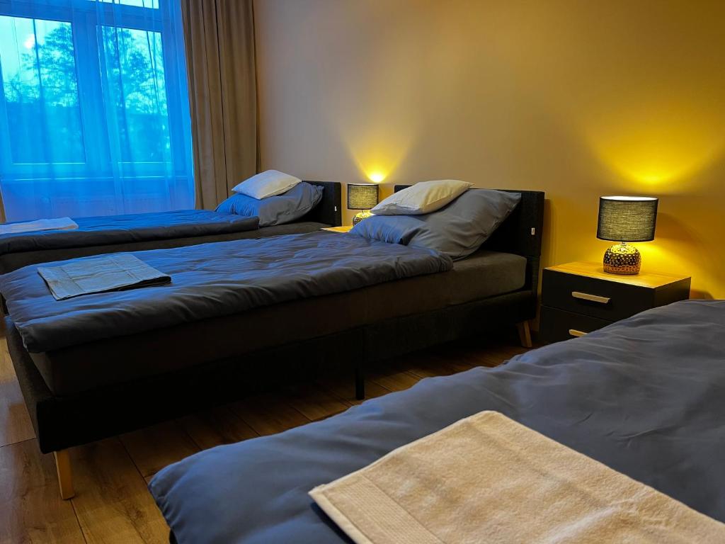 Posteľ alebo postele v izbe v ubytovaní Komfortowy Apartament w centrum