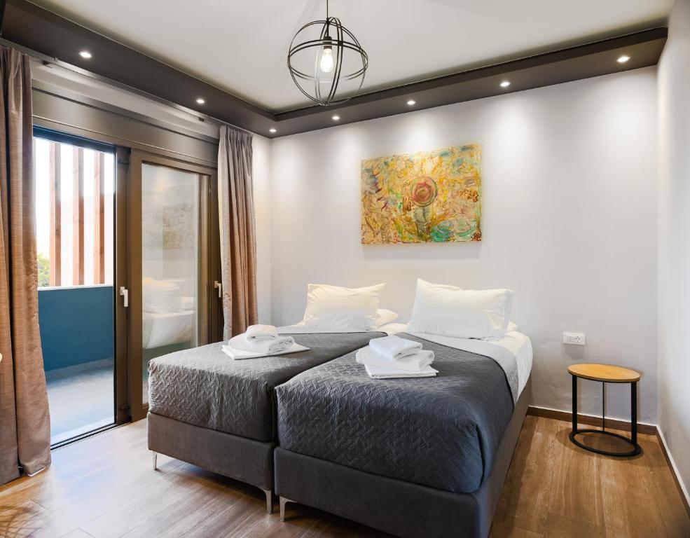 Кровать или кровати в номере Filia's Memories Apartments