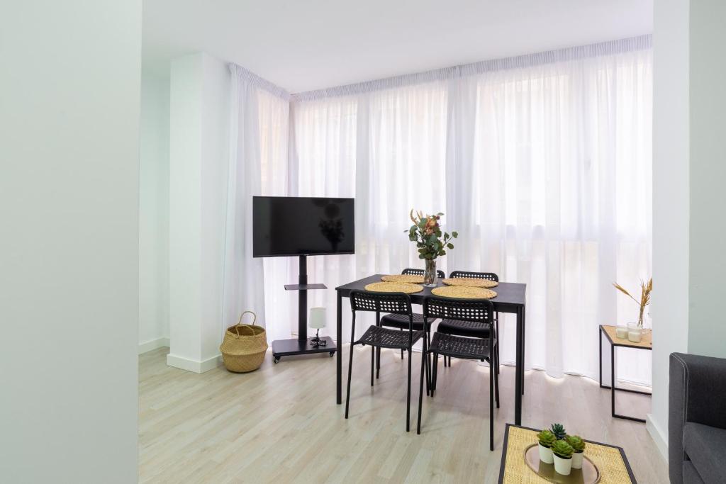 Televízia a/alebo spoločenská miestnosť v ubytovaní Malaga Centro