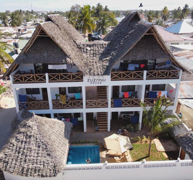 an aerial view of a hotel with a roof at Zuzanu house in Nungwi