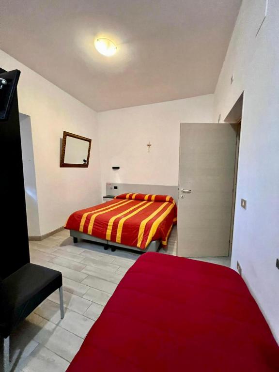 Postel nebo postele na pokoji v ubytování Hotel Centrale