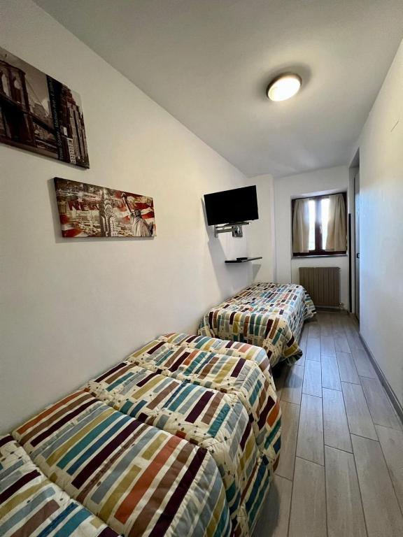 Postel nebo postele na pokoji v ubytování Hotel Centrale