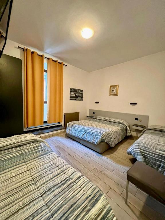 Postel nebo postele na pokoji v ubytování Hotel Centrale