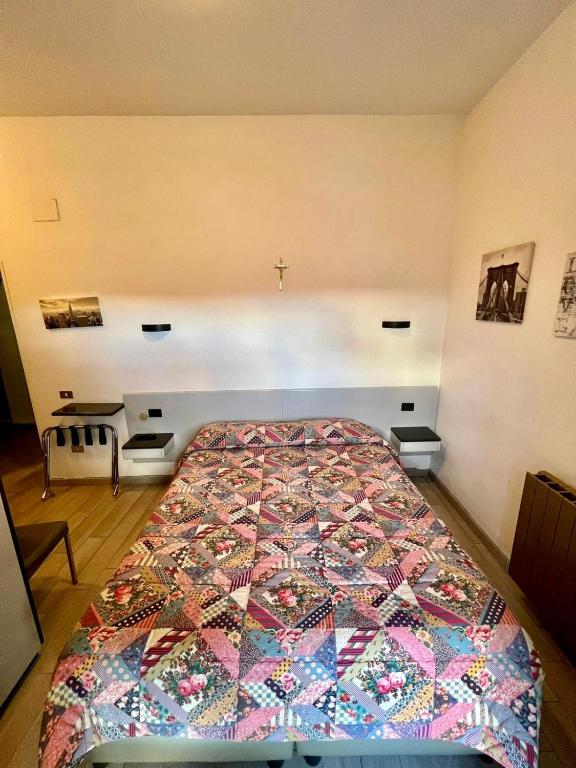 Postel nebo postele na pokoji v ubytování Hotel Centrale