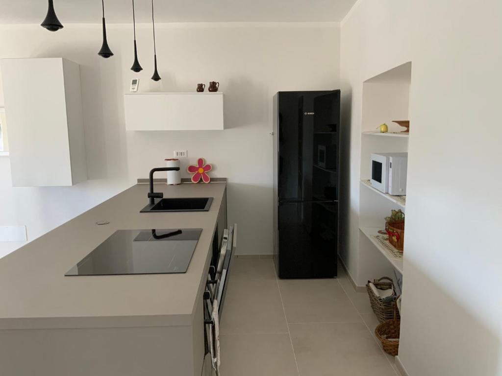 Kuchyň nebo kuchyňský kout v ubytování Appartamento Biò