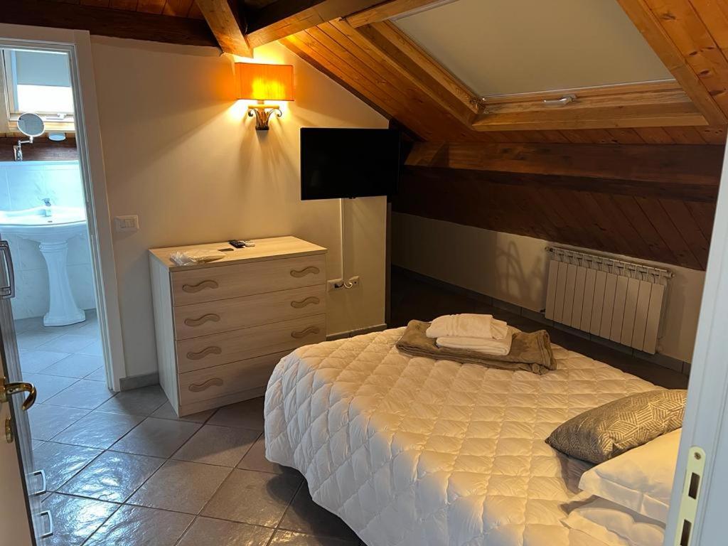 Łóżko lub łóżka w pokoju w obiekcie IL PALAZZO - Luxury Home & Event