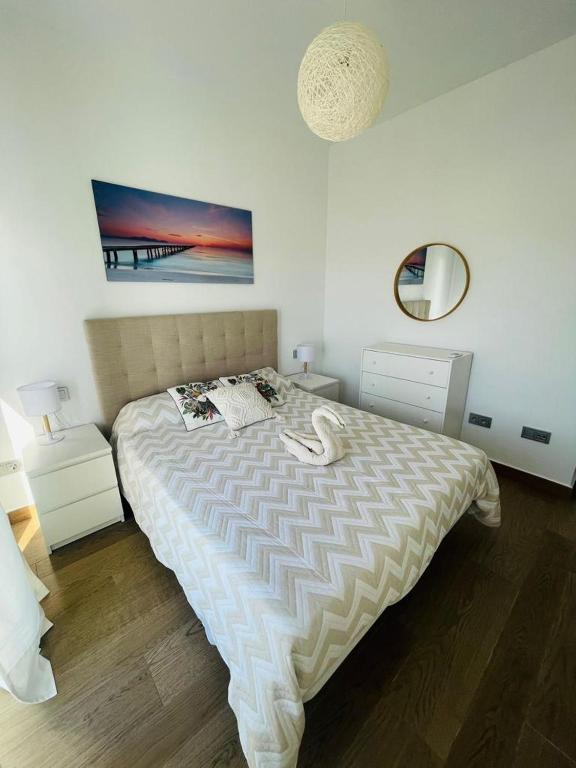 Posteľ alebo postele v izbe v ubytovaní Tríplex Cruz del Mar Beach, Apartamentos Living Sur