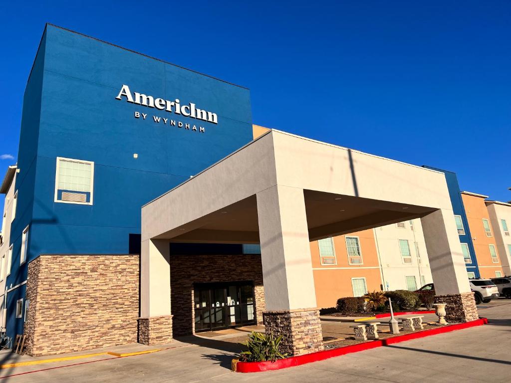 a building with an antioch sign on the side of it at AmericInn by Wyndham New Braunfels in New Braunfels