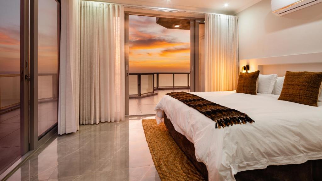 Ένα ή περισσότερα κρεβάτια σε δωμάτιο στο Beachfront Penthouse Ballito