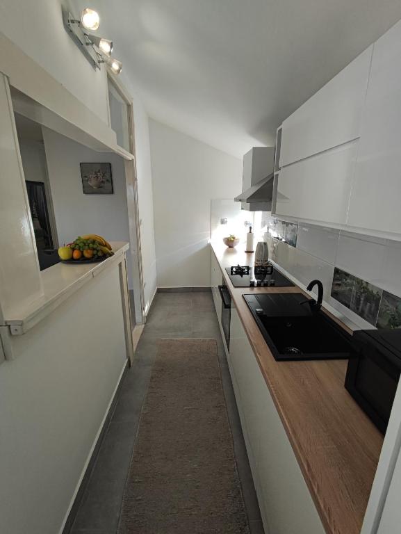 Kuchyň nebo kuchyňský kout v ubytování Apartman Oaza - Ploče, Croatia