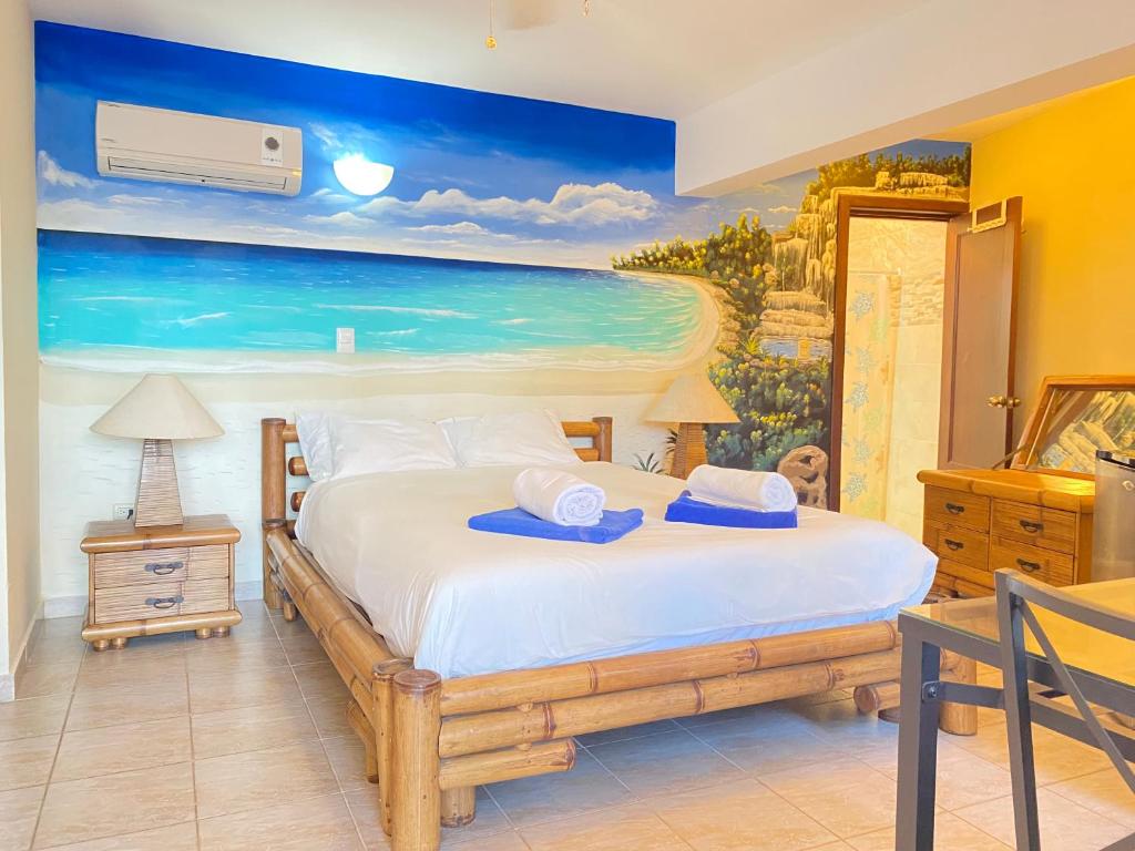 Una cama o camas en una habitación de Stanza Mare Beach Front