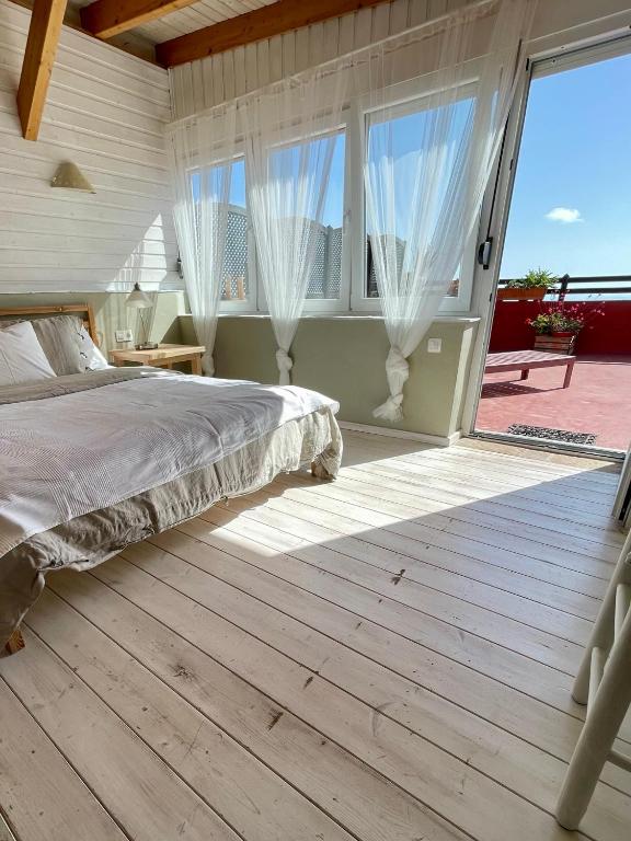 Postel nebo postele na pokoji v ubytování Sansofi Guesthouse