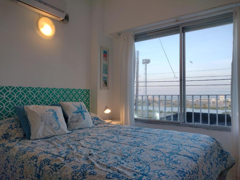 Una cama o camas en una habitación de Punta Mar