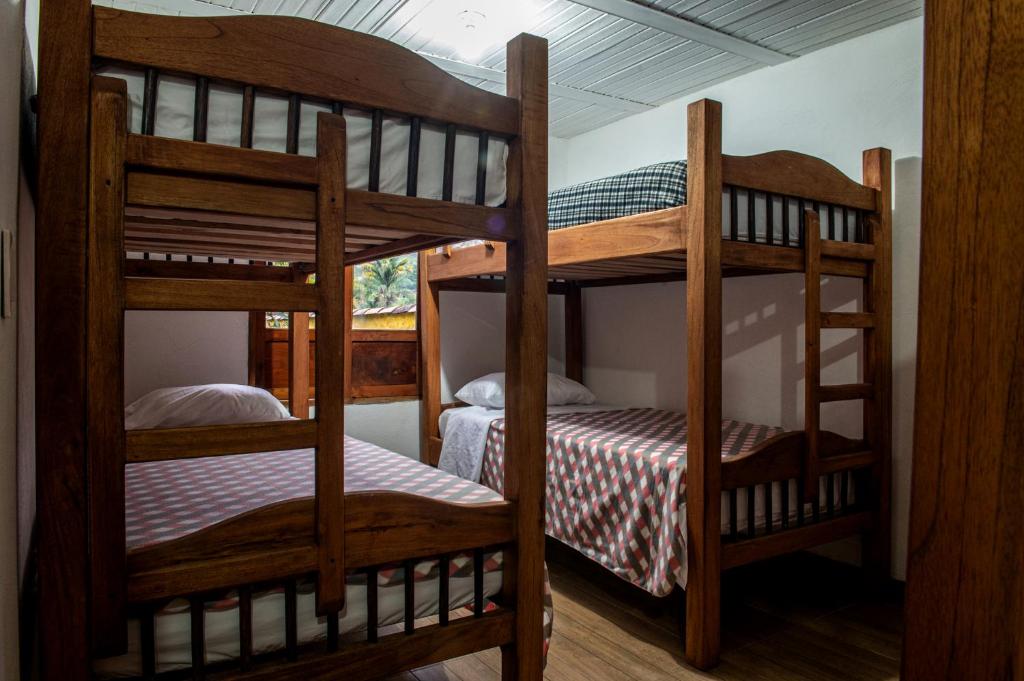 Postel nebo postele na pokoji v ubytování CAFE RACER HOSTEL