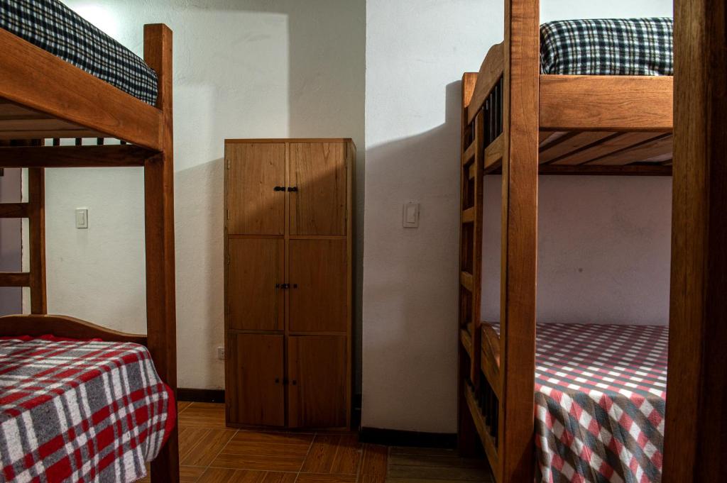 Postel nebo postele na pokoji v ubytování CAFE RACER HOSTEL