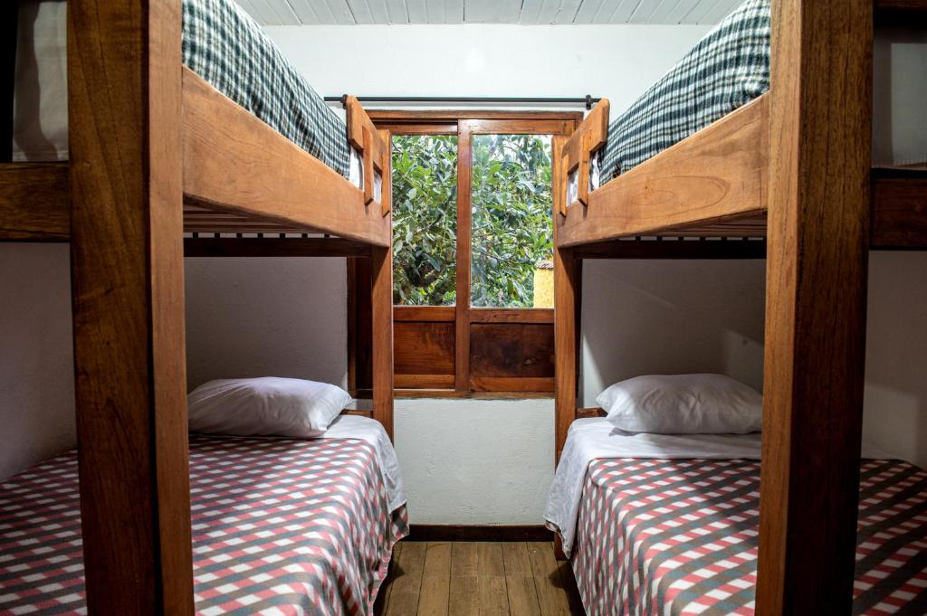 Postel nebo postele na pokoji v ubytování CAFE RACER HOSTEL