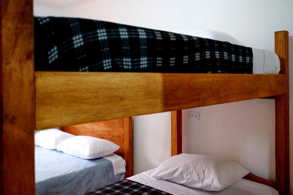 Postel nebo postele na pokoji v ubytování CAFE RACER HOSTEL