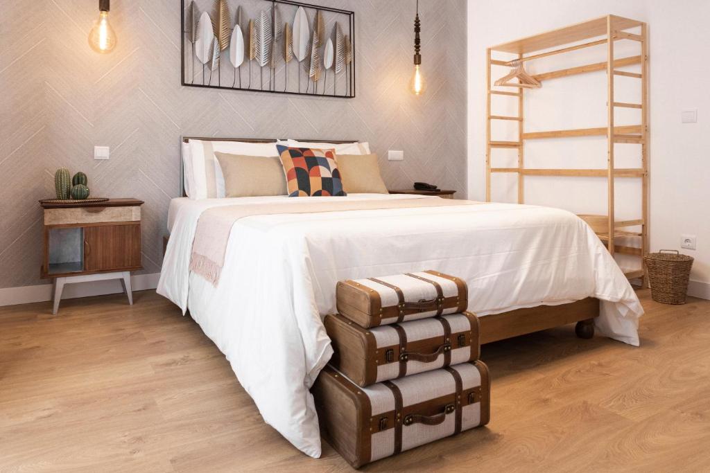Postel nebo postele na pokoji v ubytování Lugar do Ourives Boutique Hotel