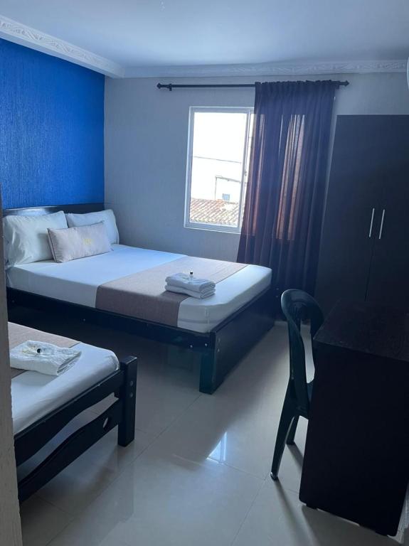 Postel nebo postele na pokoji v ubytování Hotel Chico Real