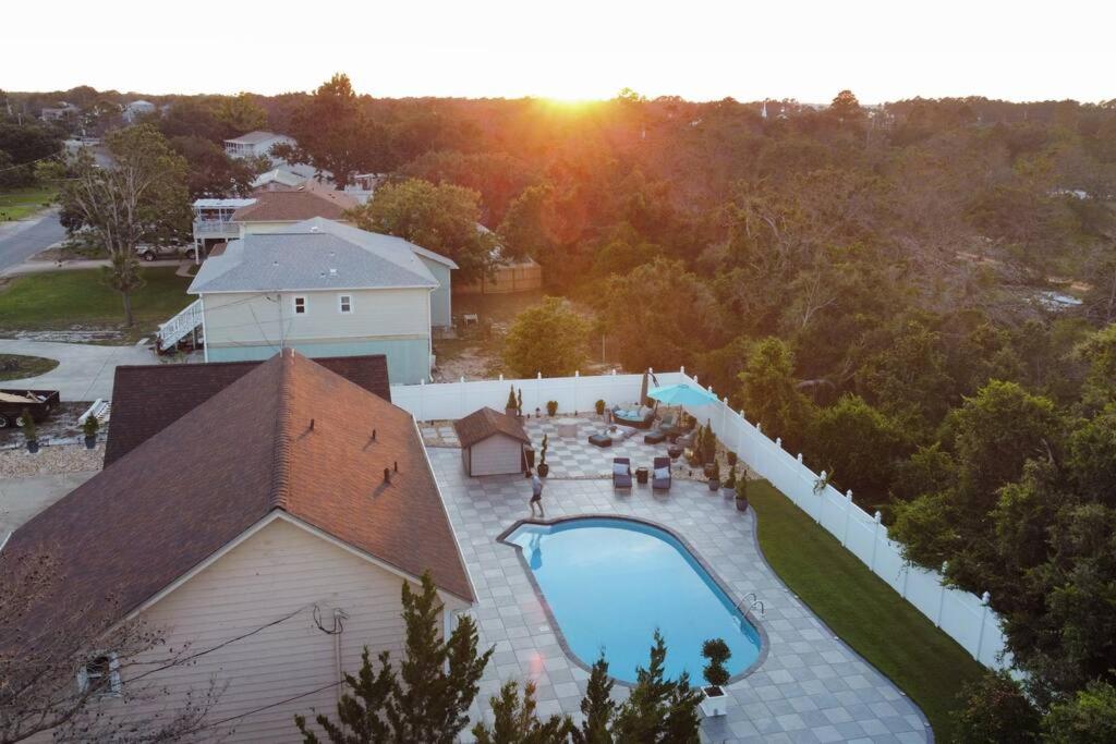 an overhead view of a swimming pool next to a building at Hermosa Flor apartment( Duplex). in Pensacola