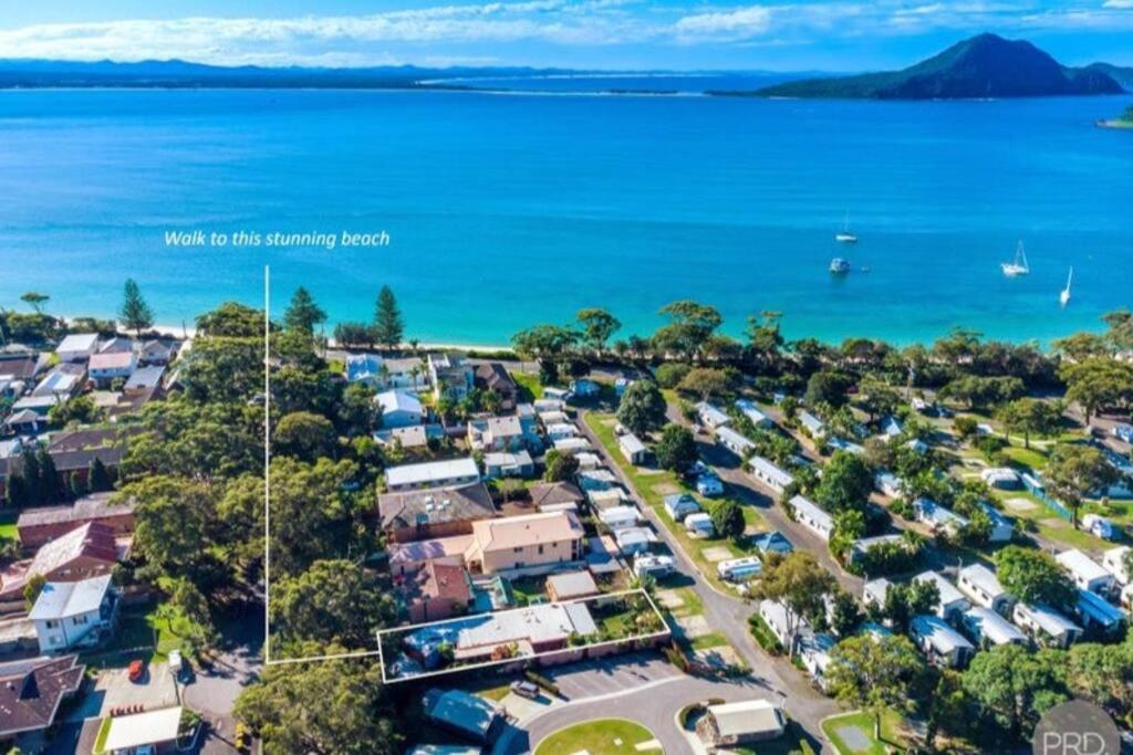 an aerial view of aucklandonga camping resort with the ocean at 'Wishing Well' - Beautiful 4 bed, 2 bath house at Shoal Bay Beach in Shoal Bay