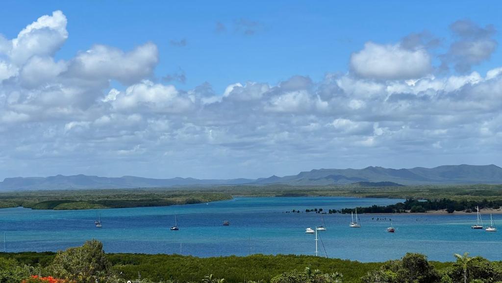 a large body of water with boats in it at The Orchid Suite - Apartment in Cooktown in Cooktown