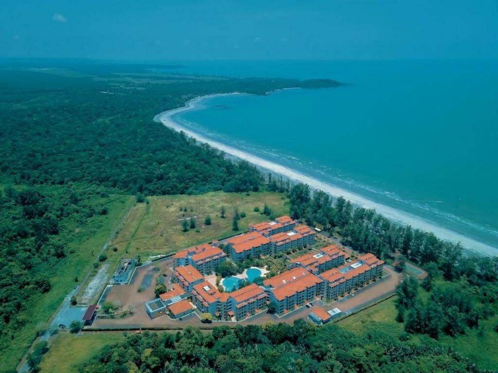 an aerial view of a resort by the water at JoJo Homestay Tiara Residence in Desaru