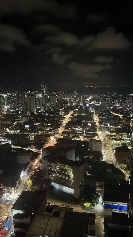 a view of a city at night at Habitación Auxiliar en Apto Compartido piso 26 in Bucaramanga