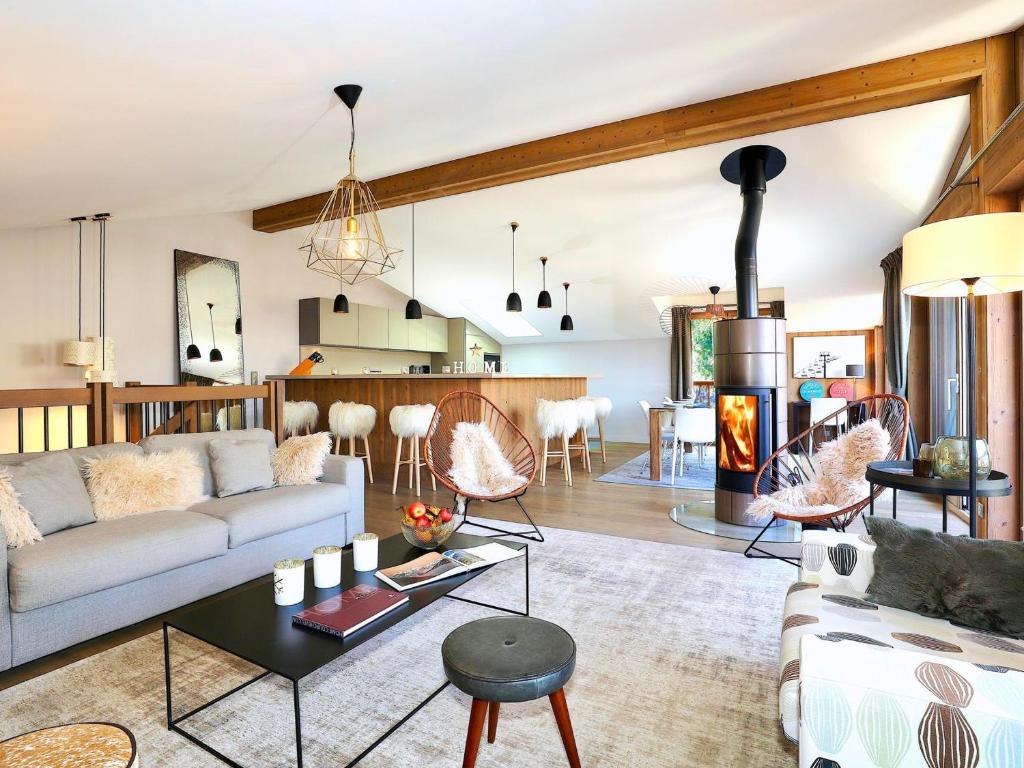 a living room with a couch and a table at Chalet Courchevel, 5 pièces, 10 personnes - FR-1-575-149 in Courchevel