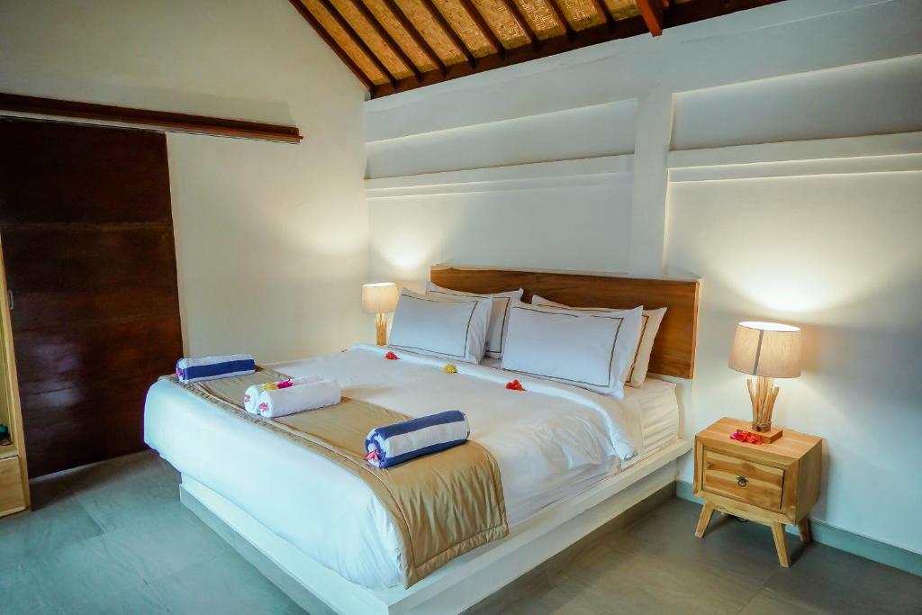 Postel nebo postele na pokoji v ubytování Marygio Gili Resort