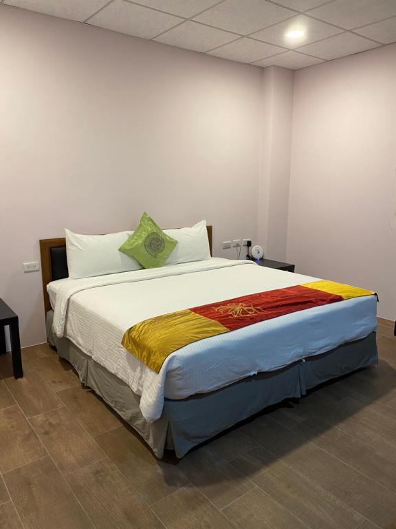 Postel nebo postele na pokoji v ubytování 恆玖民宿 Heng Jiou Homestay