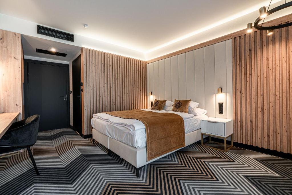 Posteľ alebo postele v izbe v ubytovaní Aparthotel Zakopane