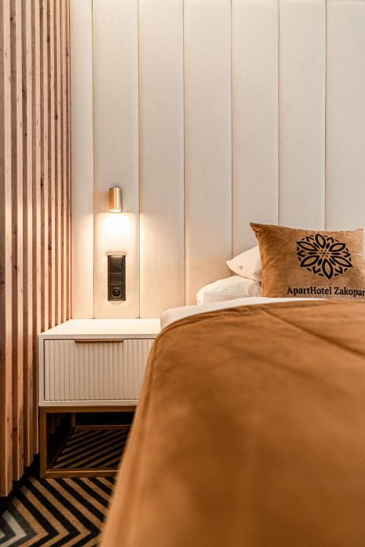 Posteľ alebo postele v izbe v ubytovaní Aparthotel Zakopane