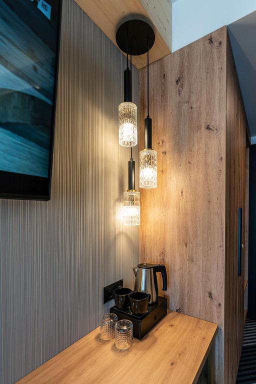 Televízia a/alebo spoločenská miestnosť v ubytovaní Aparthotel Zakopane
