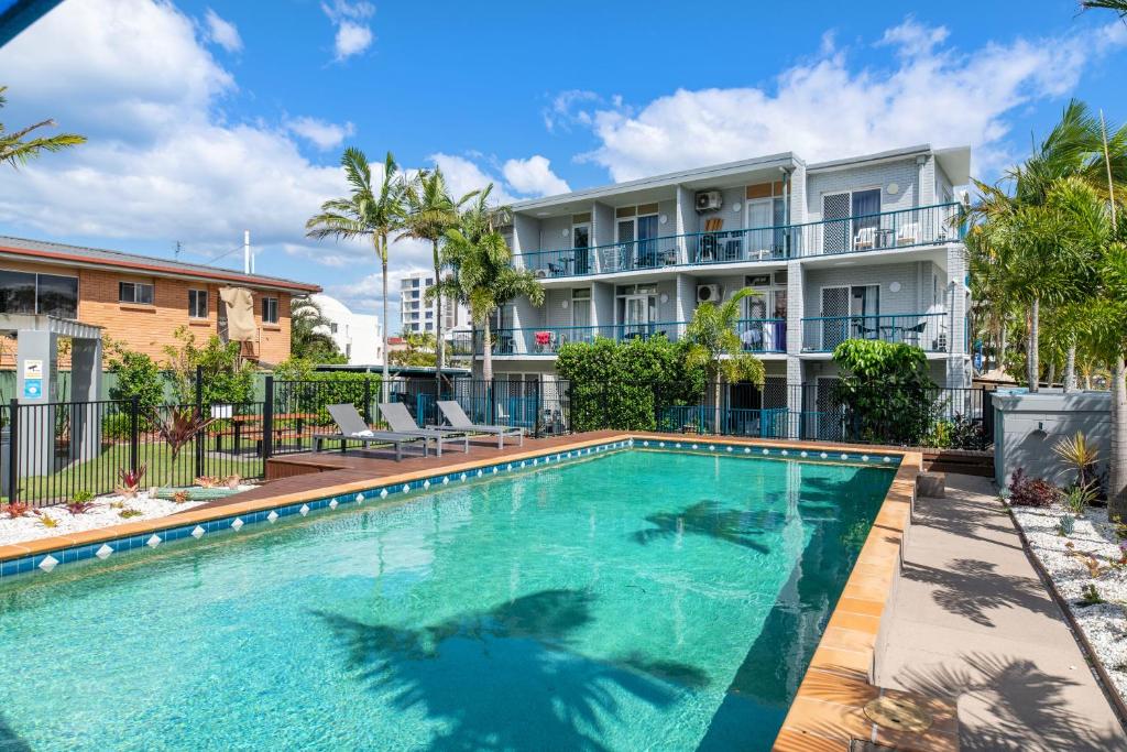 an image of a swimming pool in front of a building at Broadwater Keys Holiday Apartments in Gold Coast