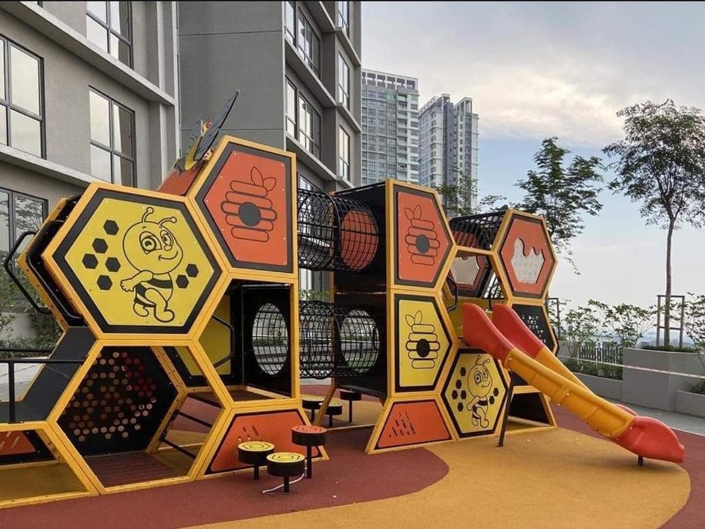 a playground with a slide in a building at The Glass Homestay Putrajaya in Putrajaya