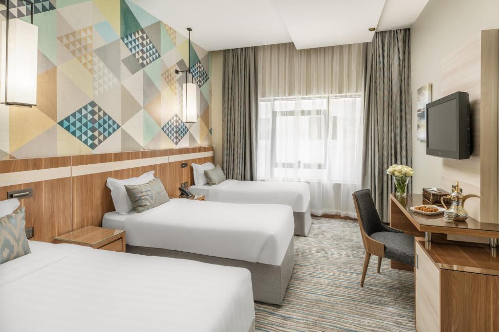 Postel nebo postele na pokoji v ubytování Roots Hotel