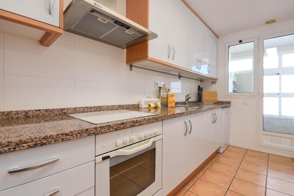 A kitchen or kitchenette at Jardines de Cannes