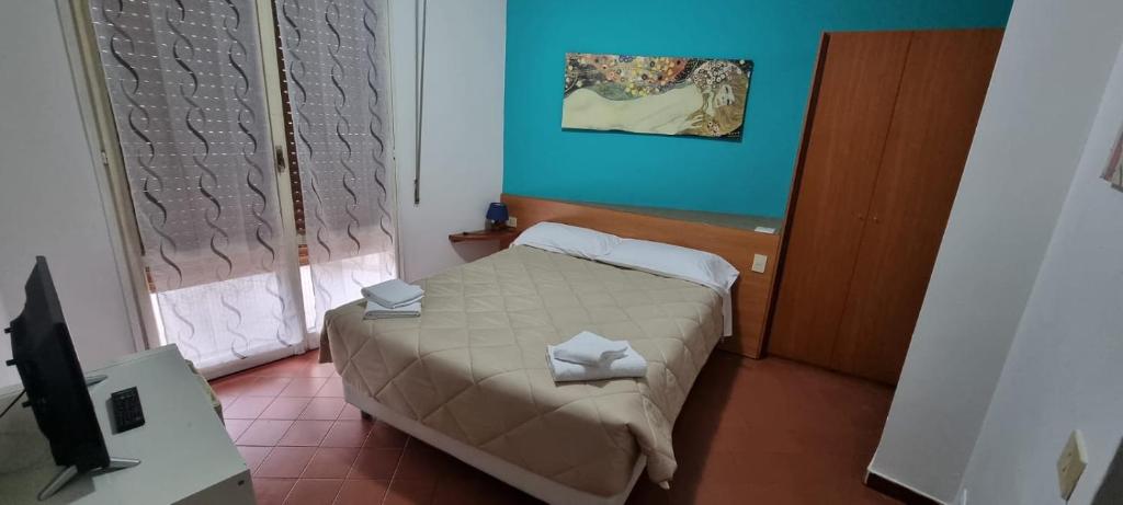 Postel nebo postele na pokoji v ubytování Hotel Indicatore
