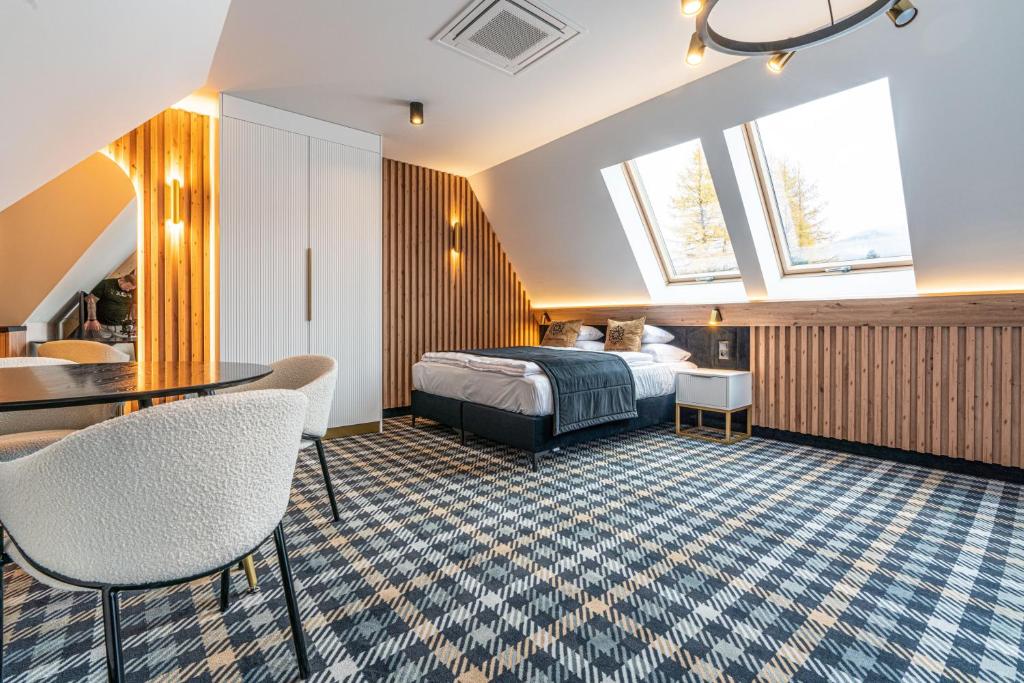 Posteľ alebo postele v izbe v ubytovaní Aparthotel Zakopane