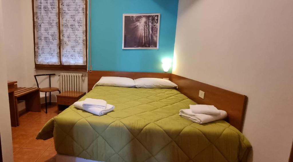 Postel nebo postele na pokoji v ubytování Hotel Indicatore
