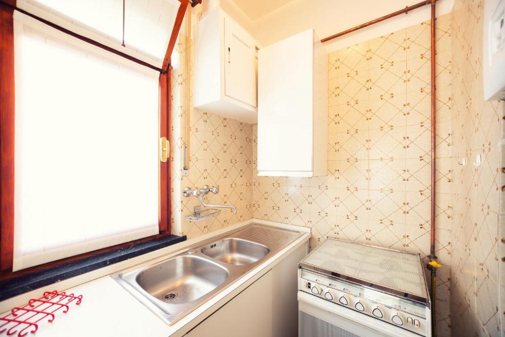 A kitchen or kitchenette at A due passi dal mare by Wonderful Italy