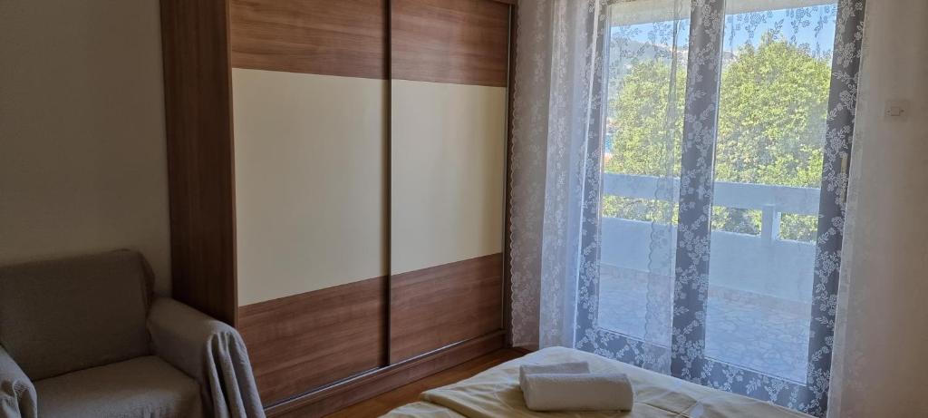 Postel nebo postele na pokoji v ubytování Renata apartment with a view
