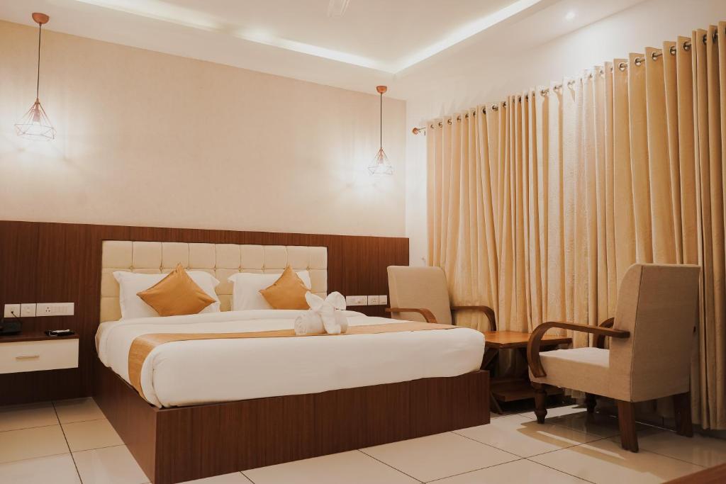 Postel nebo postele na pokoji v ubytování Sprise Munnar Resort and Spa