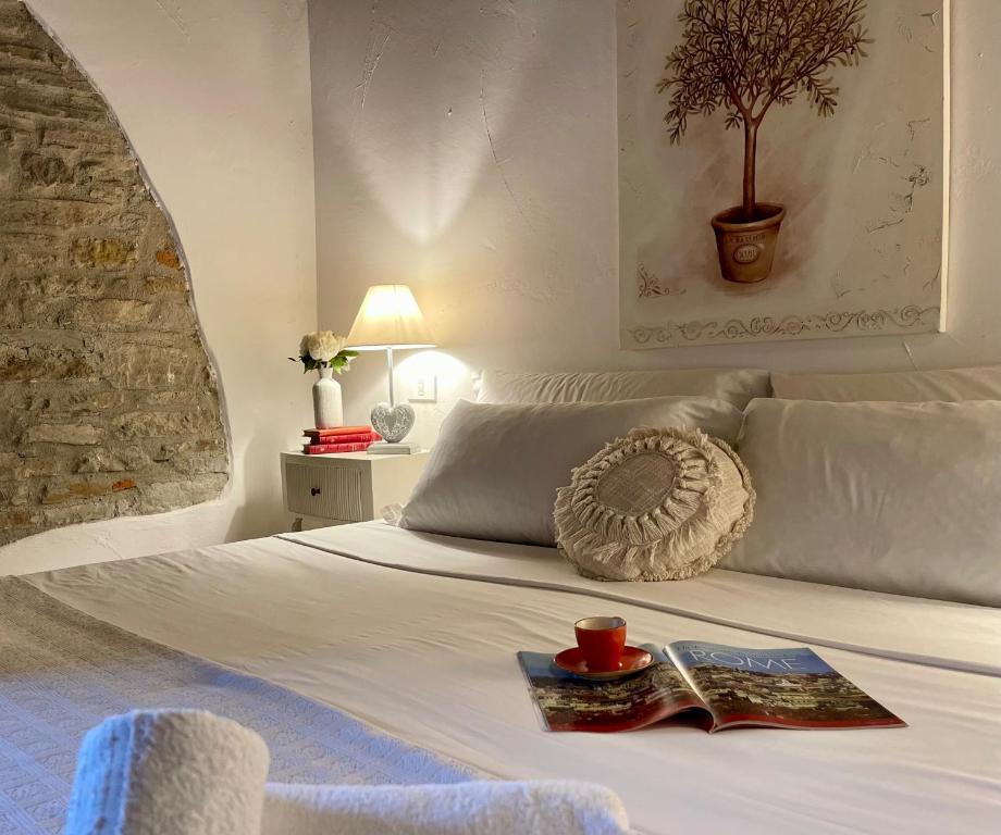Postel nebo postele na pokoji v ubytování Relais Il Pozzeto
